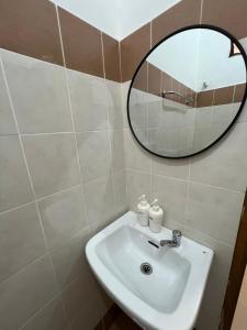a bathroom with a sink and a mirror at 7 STAY at Kuala Berang -Free WiFi & Netflix for 3 Pax in Kuala Berang