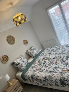 Ένα ή περισσότερα κρεβάτια σε δωμάτιο στο La maison des dunes