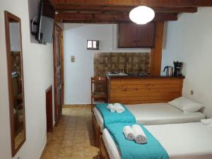 Postel nebo postele na pokoji v ubytování Guesthouse Chryssoula