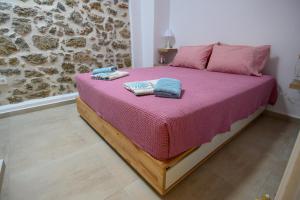 מיטה או מיטות בחדר ב-Konstantis
