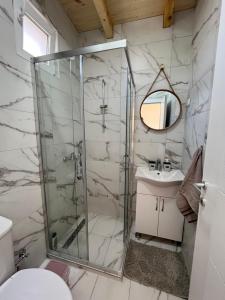 a bathroom with a shower and a sink at Villa & Apartments Cityview Ohrid in Ohrid +52 photos