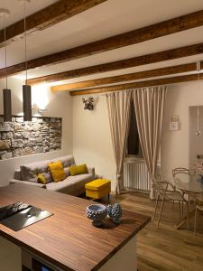 a living room with a couch and a table at LaLucia Luxury Suite Lake Como in Argegno