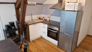 Kuchyňa alebo kuchynka v ubytovaní L'appartement - domaine des ducs