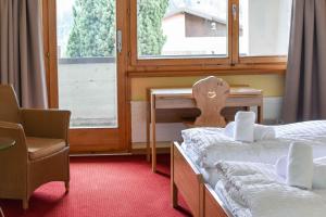Voodi või voodid majutusasutuse Hotel Pazzola toas