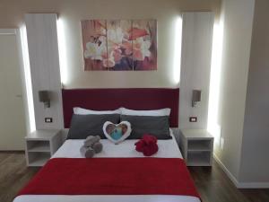 a bedroom with a bed with two stuffed animals on it at Venice Airport Villa Erica 1 in Campalto