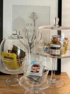 a table with two glass containers with food in them at La ROMANTICA VERONA in Verona