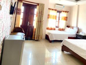 Postel nebo postele na pokoji v ubytování Trung hoa HOTEL