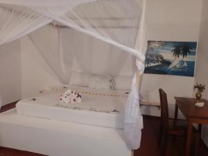 Postel nebo postele na pokoji v ubytování Babalao Rooftop Hotel