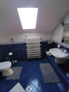Koupelna v ubytování Elza Apartman