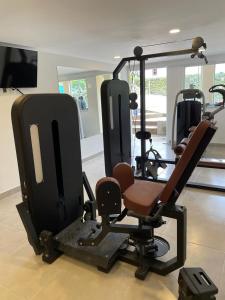 a gym with several exercise equipment in a room at Pousada Renovo da Serra in São Pedro da Serra