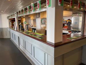 a bar in a restaurant with a counter top at Seabank Hotel in Porthcawl