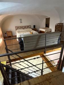 a bedroom with a large bed in a room at Lūǧārah - elegante loft in centro storico in Lucera