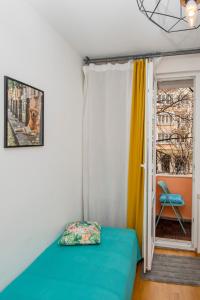 a bedroom with a bed and a window with a chair at Casa Dolce Far Niente, 2BATH&2BED in Sofia