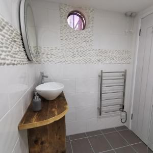 Ванная комната в AnchorageWells Lodge, Seaview Apartment