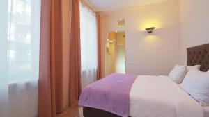 Postel nebo postele na pokoji v ubytování Lviv Euro Hostel