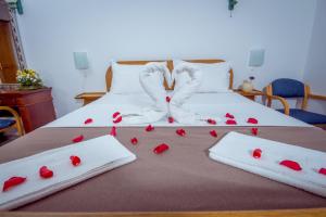 Voodi või voodid majutusasutuse Hotel Pharos toas
