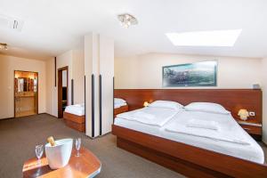 Postel nebo postele na pokoji v ubytování Hotel Palace