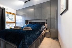 Кровать или кровати в номере AMK Apartament 12 Premium Gdynia Centrum