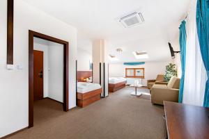 Postel nebo postele na pokoji v ubytování Hotel Palace