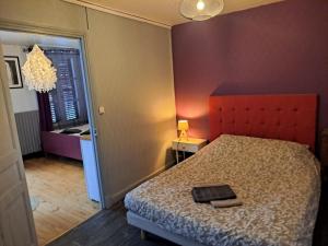 Posteľ alebo postele v izbe v ubytovaní Charmant appartement au cœur des volcans d Auvergne
