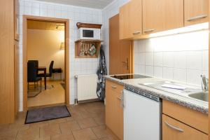 Kuchyň nebo kuchyňský kout v ubytování Haus 1 + 6 fotografií