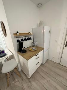 Kuchyňa alebo kuchynka v ubytovaní Appartement spacieux - proche centre et therme