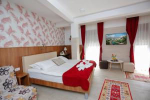 Postel nebo postele na pokoji v ubytování Hotel - Villa Lejla