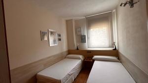 Postel nebo postele na pokoji v ubytování Apartamentos LOS TULIPANES