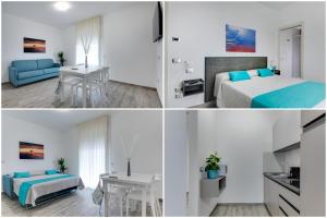 a hotel room with a bed and a table at Elegance Suite Apartments in Cervia