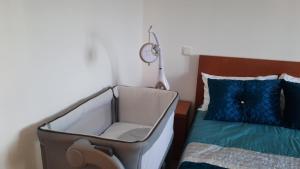 a bedroom with a bed with a glass case on it at Quinta do Iteiro in Cova +14 photos