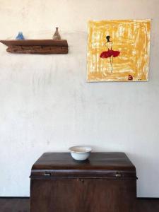 a wooden table with a bowl on top of it at Elite apartment in Limenaria