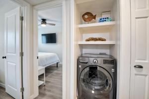 a laundry room with a washer and dryer at Tower 9 D in Oceanside
