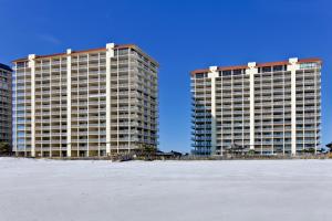 two tall buildings on the beach with the ocean in front at Summer House 703B by ALBVR - Great Beachfront Condo with Oversized Balcony & Amazing Views! in Orange Beach
