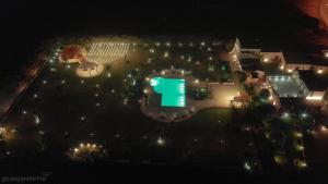 an overhead view of a park at night with lights at Casal Sikelio in Cassibile