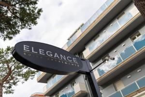 a sign for the entrance to a building at Elegance Suite Apartments in Cervia