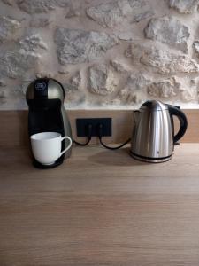 a coffee maker and a tea kettle on a counter at Hidden Heritage in Skradin