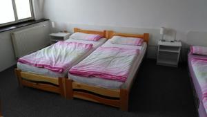 Postel nebo postele na pokoji v ubytování Penzion Nová Ves