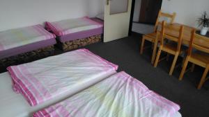Postel nebo postele na pokoji v ubytování Penzion Nová Ves