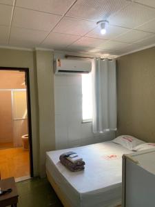 a room with a bed and a window in it at Hotel BELCENTRO in Belém