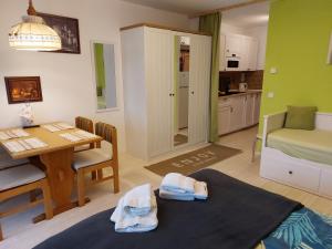 a living room with a table and a dining room at Ferienwohnung 6 Bergblick in Sankt Gilgen