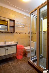 a bathroom with a sink and a toilet at Elegant 2bedroom apartments close to city center in Kampala