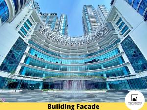 a building facade with a fountain in front of it at Pacific Homestay Petaling Jaya @ 1 Utama and Universiti Malaya in Petaling Jaya