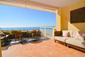 a living room with a view of the ocean at Precioso Duplex frente al mar en Campoamor Alicante in Campoamor