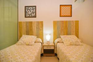 Posteľ alebo postele v izbe v ubytovaní Beach & Golf seafront house Campoamor Alicante