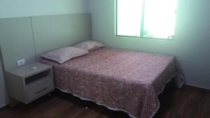 מיטה או מיטות בחדר ב-Compras e Turismo - Foz do Iguaçu-PR