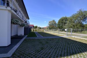 a driveway of a building with a soccer field at Villa Bueno Bis in Rowy