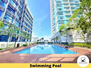 a swimming pool in the middle of a building at Pacific Homestay Petaling Jaya @ 1 Utama and Universiti Malaya in Petaling Jaya