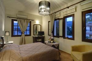A bed or beds in a room at Enalion Hotel