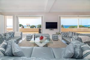 a living room with a couch and a table at Casa Nua in Puerto del Carmen