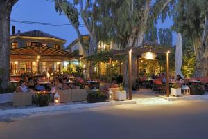 A restaurant or other place to eat at Enalion Hotel